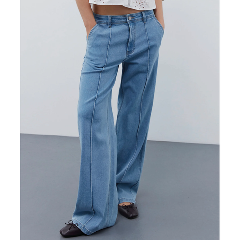 low rise wide leg long trousers with seam detail down the front of the leg. zip and button fastening and belt loops 