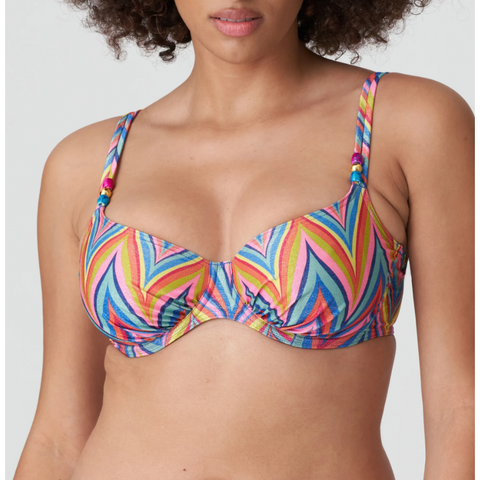 Trendy bikini top with full cups and multi-colored, zigzag stripes. The multiway straps can be worn either over the shoulders or around the neck. 70’s glamour for the beach! Rainbow Paradise is a summery, multi-colored pint with glittery detailing.